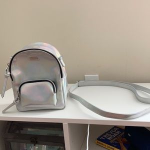 This is a Vans maroon mini back pack.